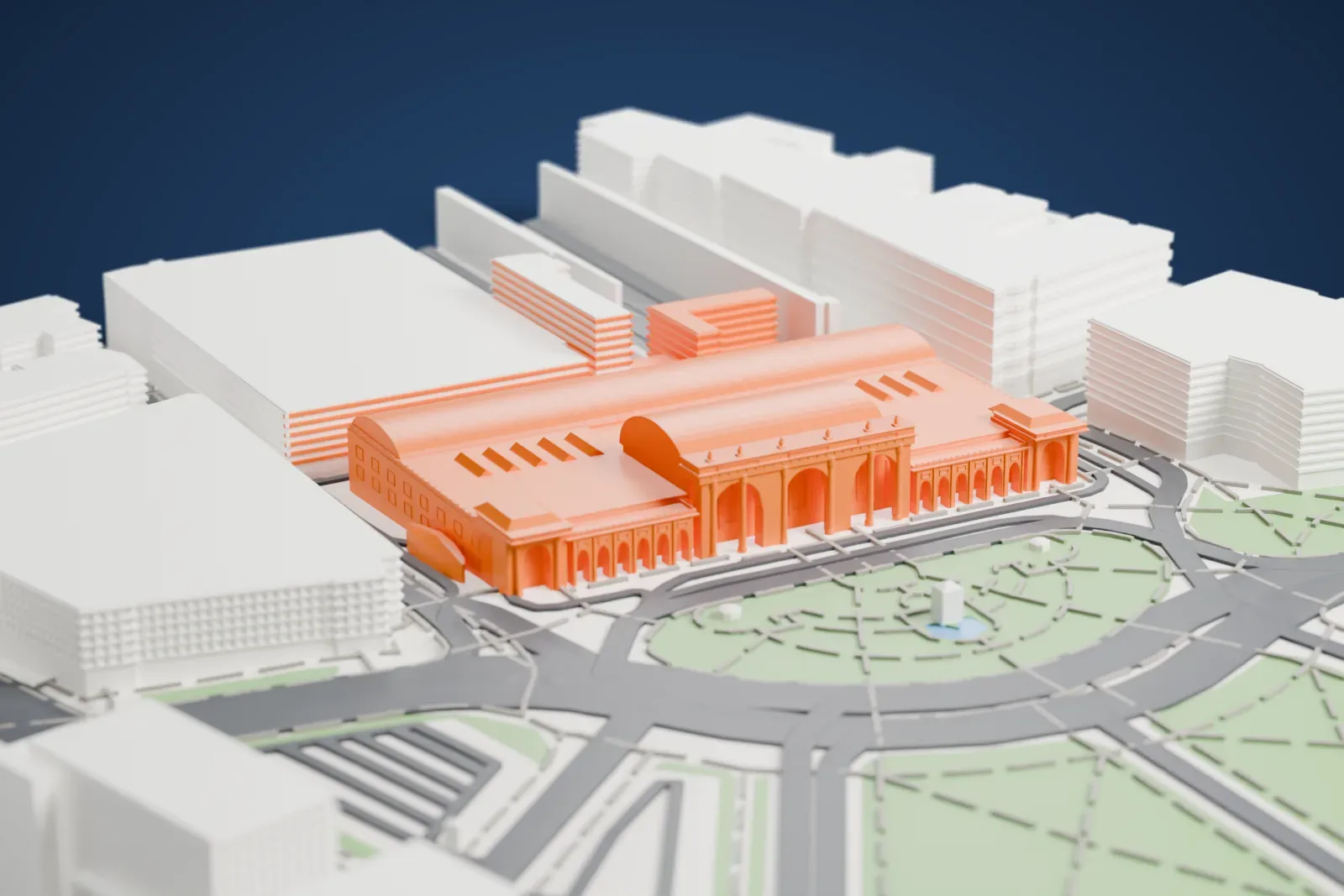 A white 3D print of Washington Union Station, a long hall with curved roofs and an arched, columned front, facing a circular plaza with green lawns and wide roads.