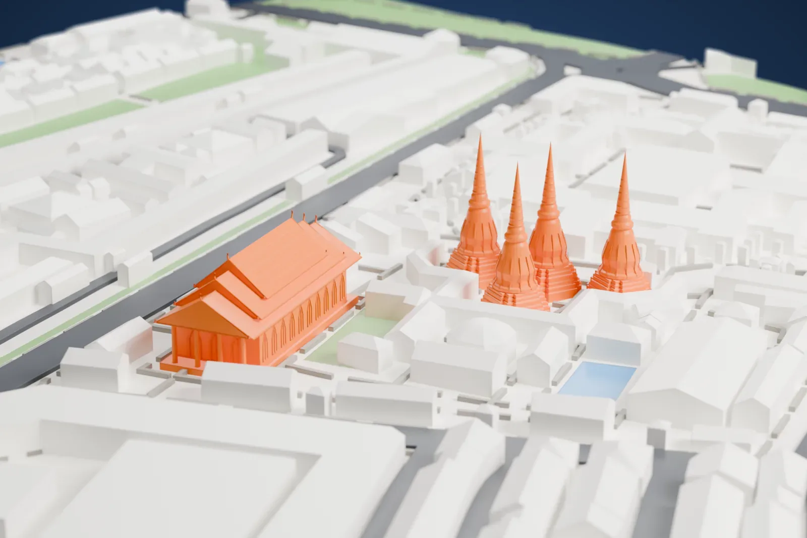 A white 3D print of Wat Pho, a group of four tall pointed towers beside a large hall with a layered roof, set among dense Bangkok buildings and streets.