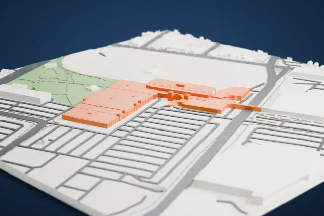 A white 3D print of the Western Fair Raceway Grandstand model in London, Ontario, with the streets around it.