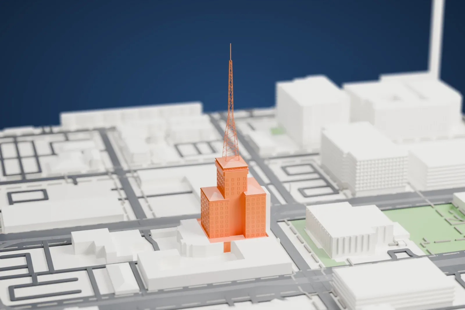 A white 3D print of the Westward Ho, a stepped high-rise topped by a tall lattice tower and thin mast, standing among streets and low buildings.