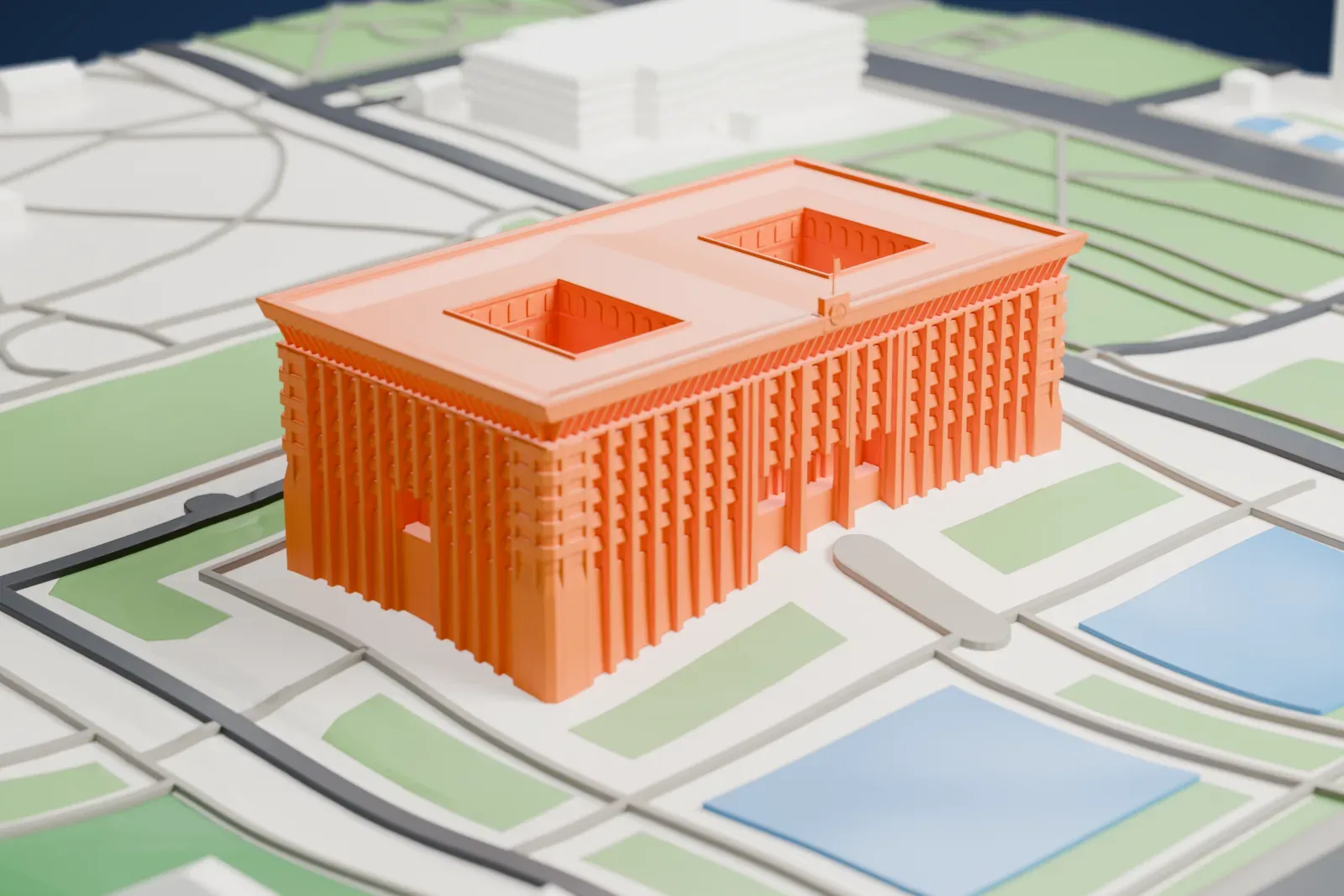 A white 3D print of the White House in Bishkek, a long seven-story block with a grid of pilasters and two recessed roof courts, with paths, green areas and water around it.