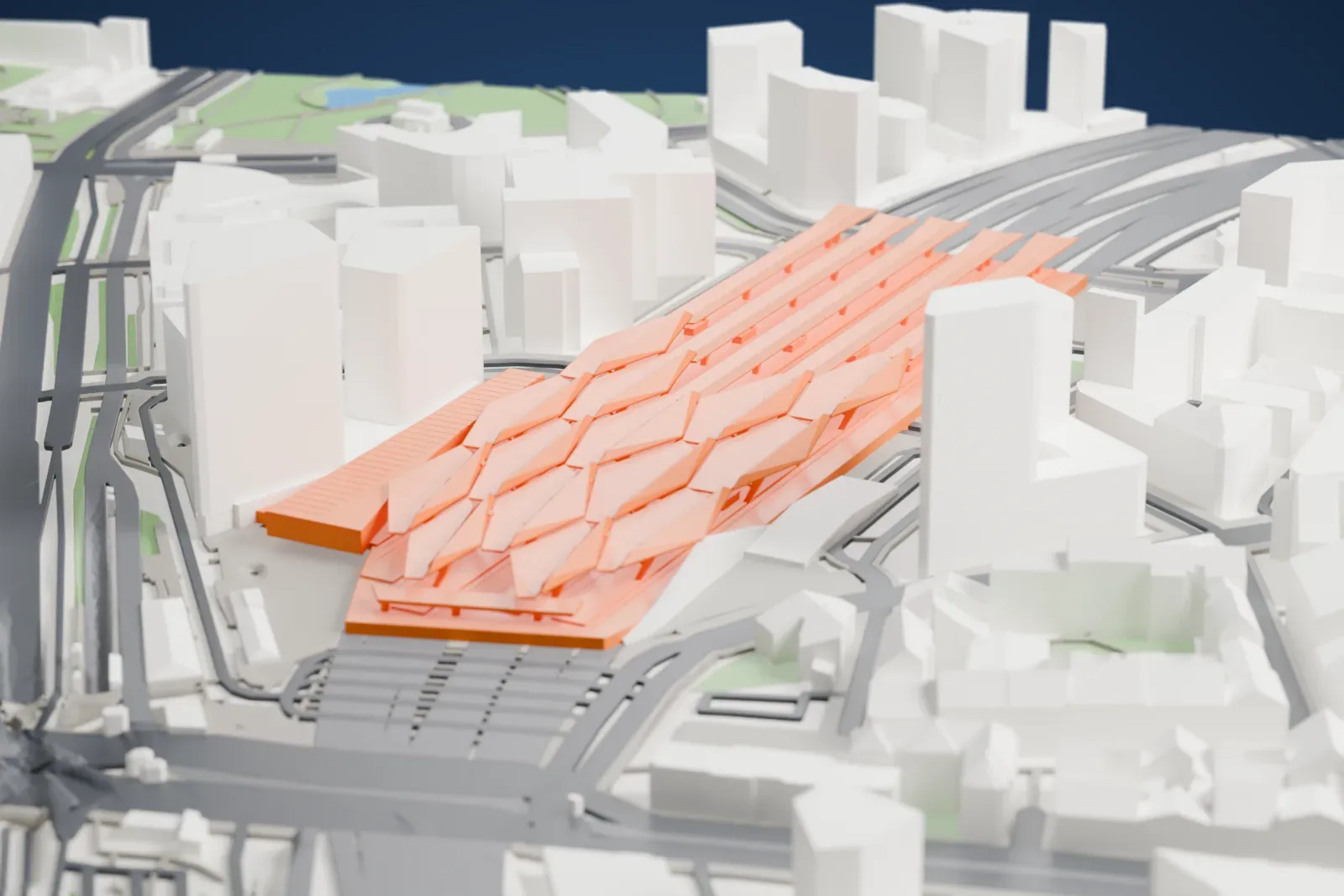 A white 3D print of Wien Hauptbahnhof, its long platform canopies set among the surrounding streets and buildings of Vienna.