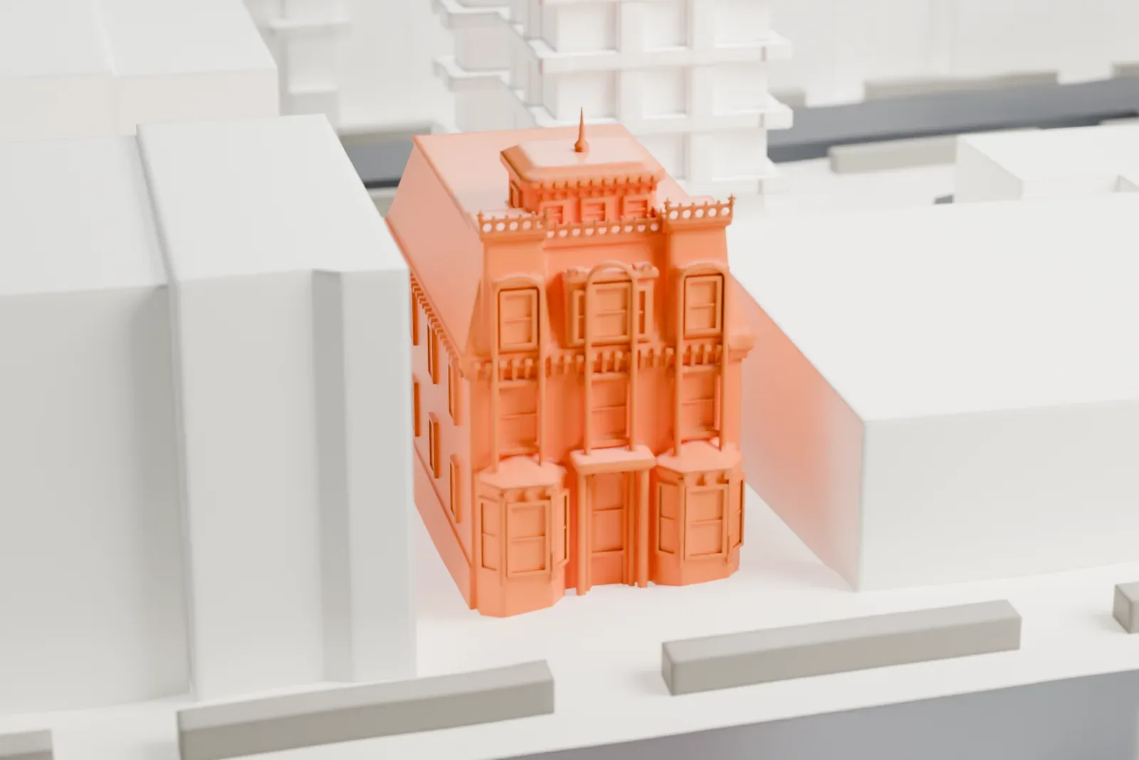 A white 3D print of the William B. Cronyn House, a small house with a mansard roof and cupola, hemmed in by larger neighboring buildings.