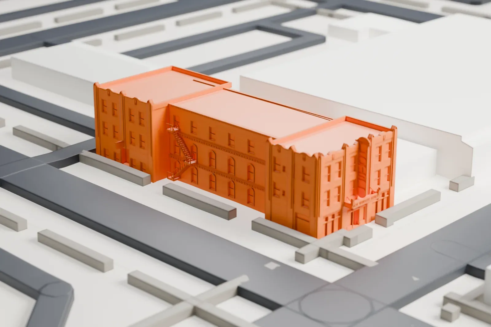 A white 3D print of the Windsor Hotel, a low flat-roofed building set on a city block with streets and neighboring buildings around it.