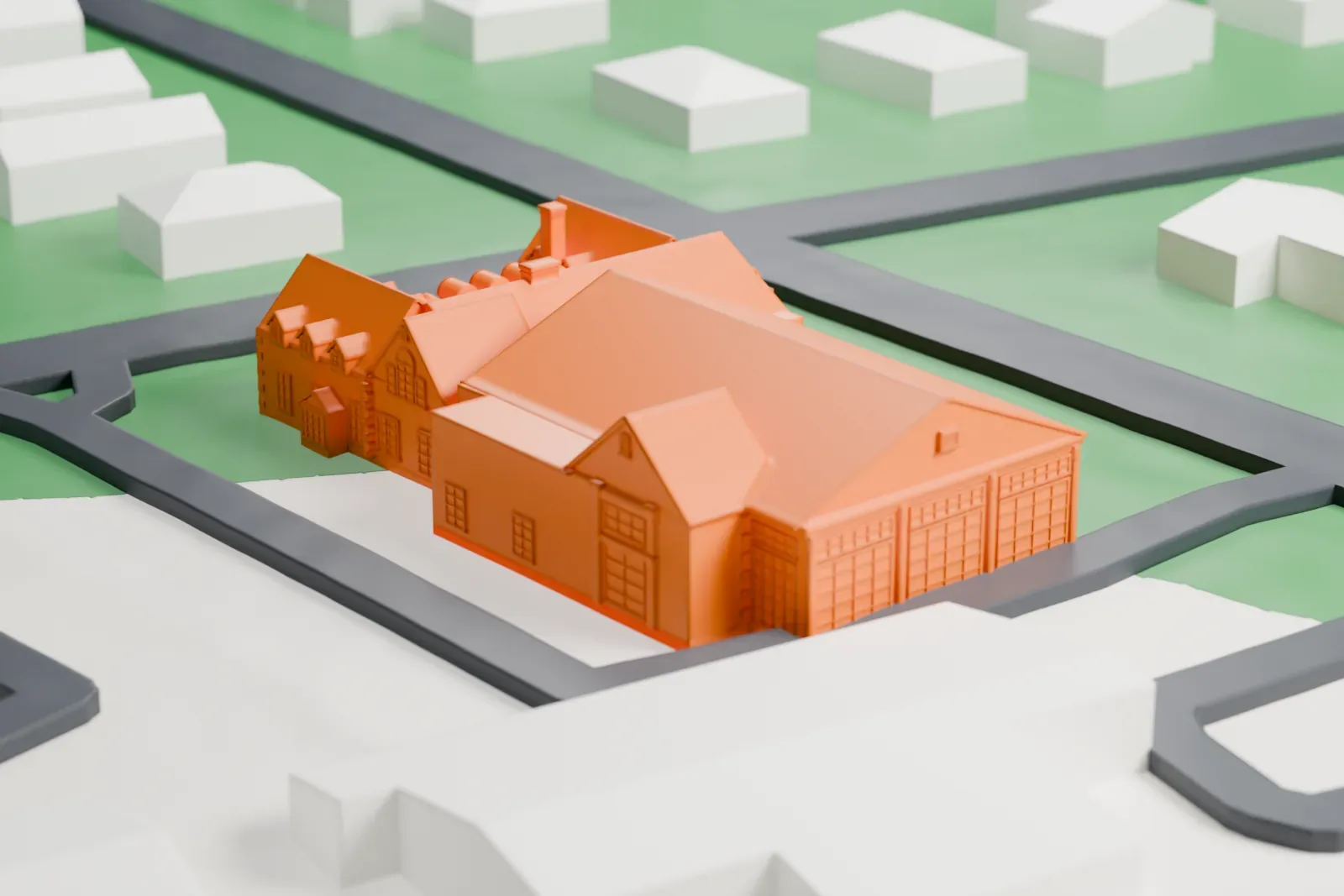 A white 3D print of the Woman's Club of Upper Montclair, a gabled clubhouse with two wings, set on green lawns between streets and houses.