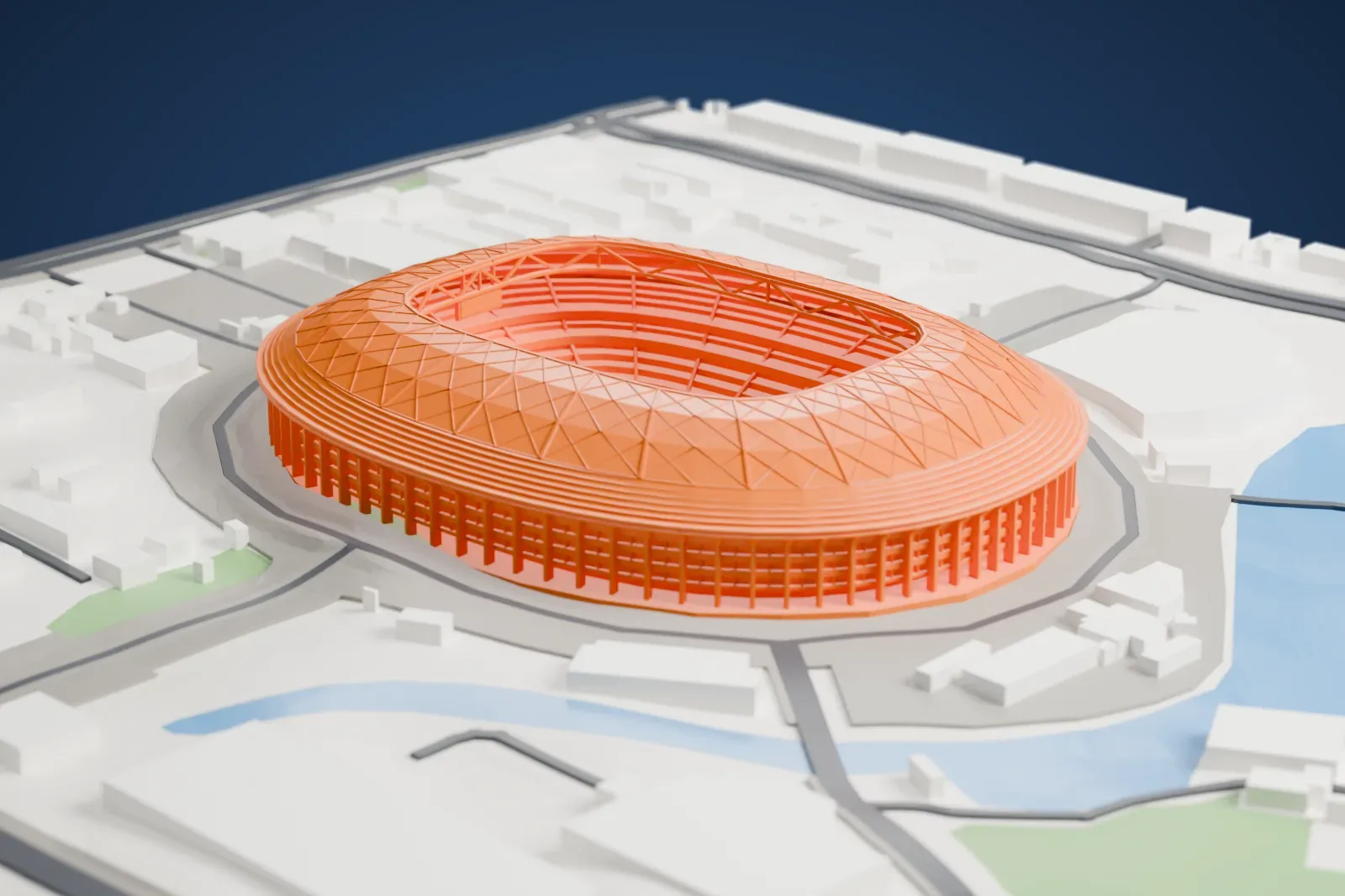 A white 3D print of Workers' Stadium, a low oval arena with a piered concrete facade and an open-centered roof, among surrounding streets and buildings.
