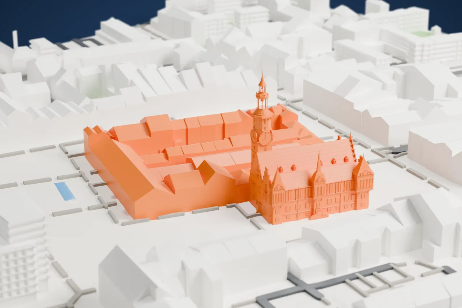 A white 3D print of the Wrocław Old Town Hall, a Gothic hall with stepped gables, small turrets and a tall clock tower, among tightly packed buildings.