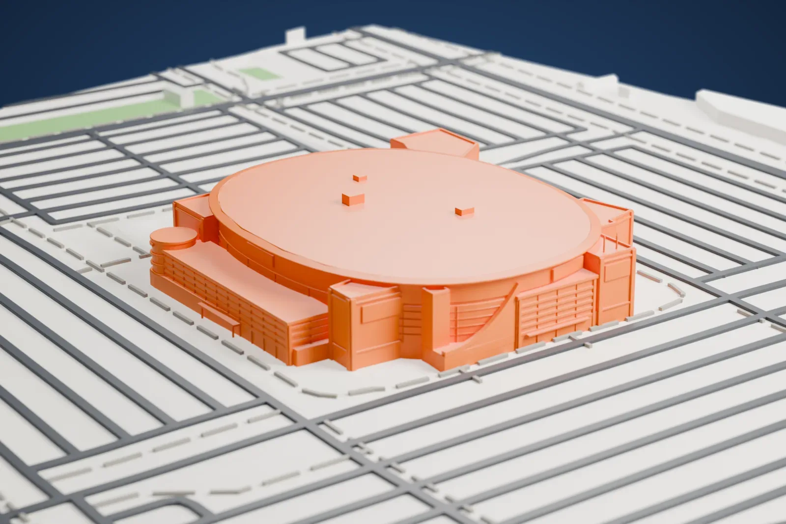 A white 3D print of Xfinity Mobile Arena, a smooth rounded drum with a thin projecting blade at the roof line, crowded by lower flat-topped blocks and glass halls, among the surrounding streets.
