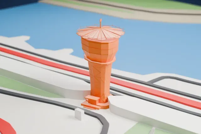 A white 3D print of the Shams Tower, Yas Marina Circuit model in Abu Dhabi, with the streets around it.