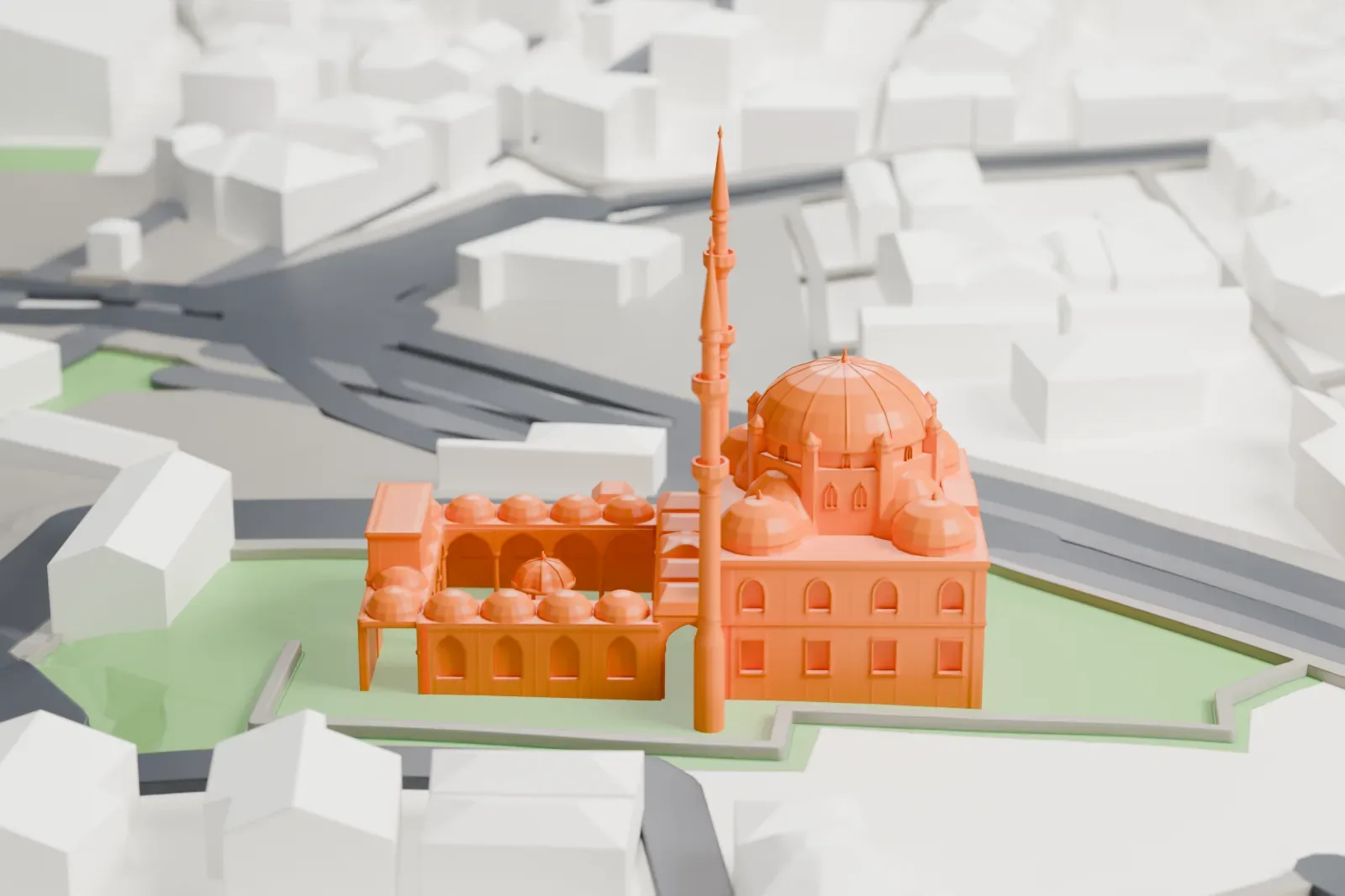 A white 3D print of the Yeni Valide Mosque, an Ottoman mosque with a central dome and two minarets, among the surrounding streets and buildings of Üsküdar in Istanbul.