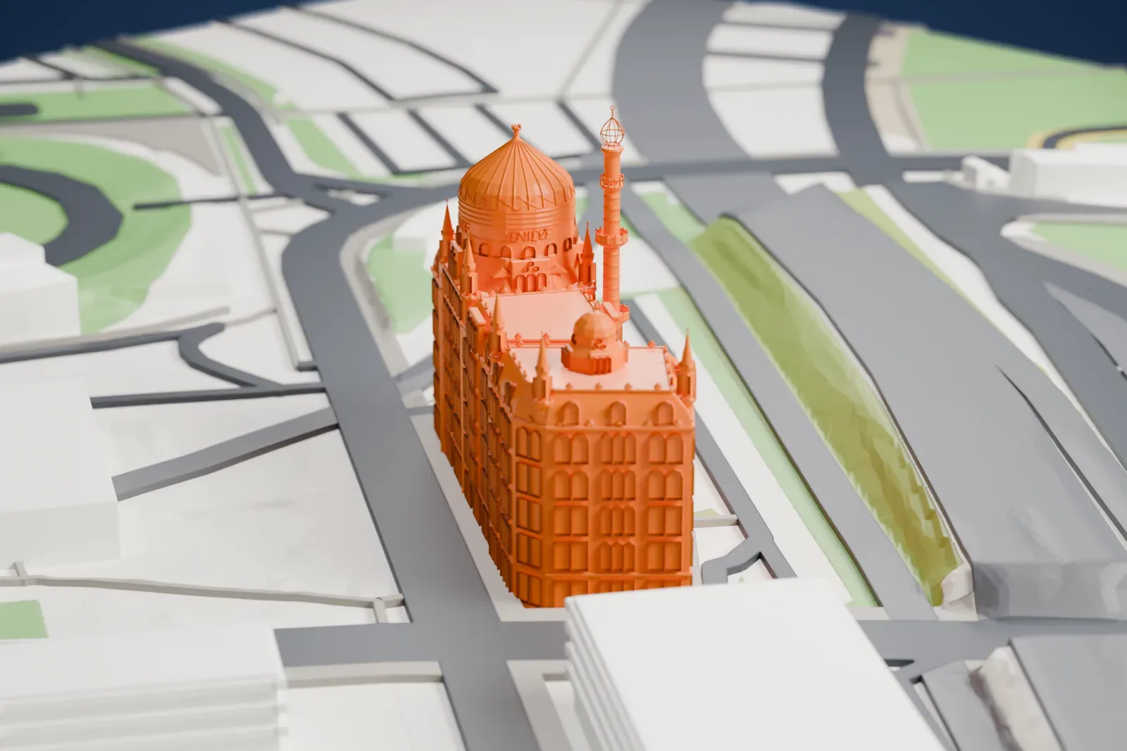 A white 3D print of Yenidze, a long factory building with a pointed glazed dome, a slender chimney and seven small spires along its roof, among surrounding streets and buildings.