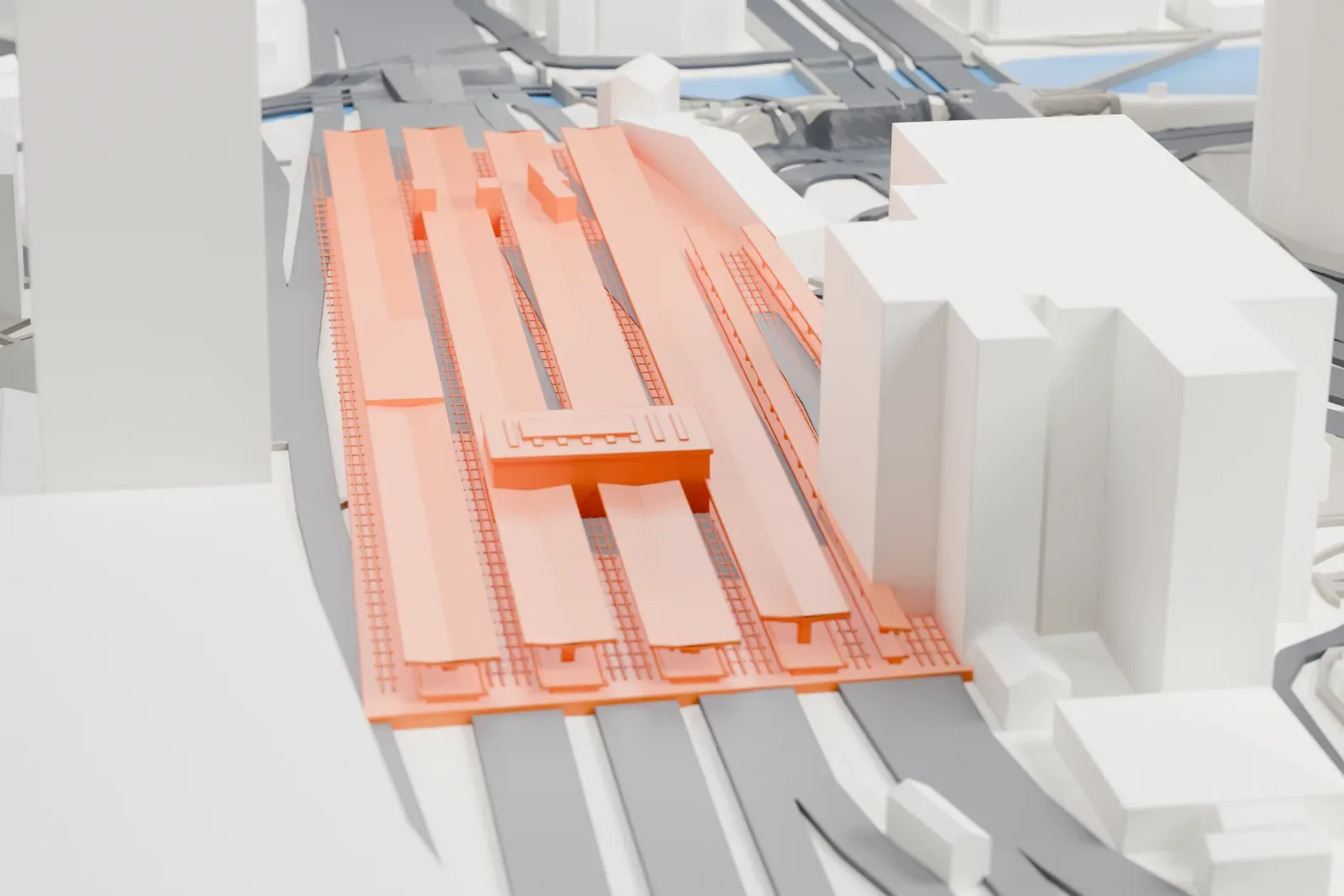 A white 3D print of Yokohama Station, a low station complex, among the surrounding streets and buildings.