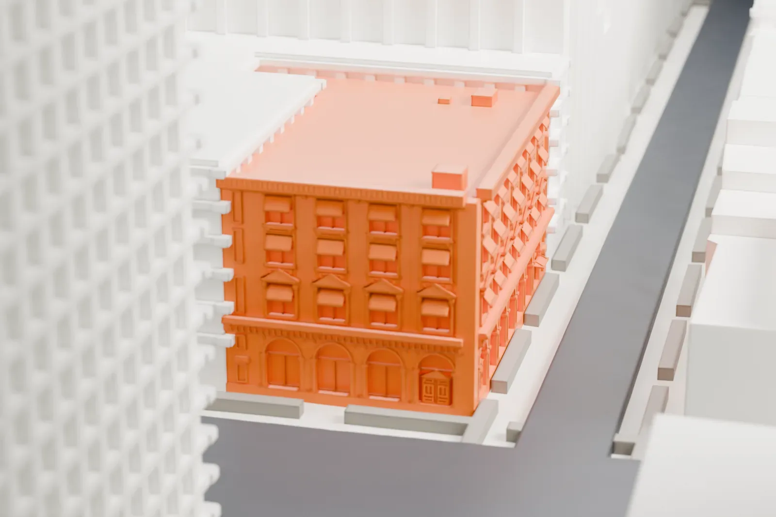 A white 3D print of the Yorkville Bank Building, a low block with arched ground-floor windows and a decorated cornice, between much taller buildings.