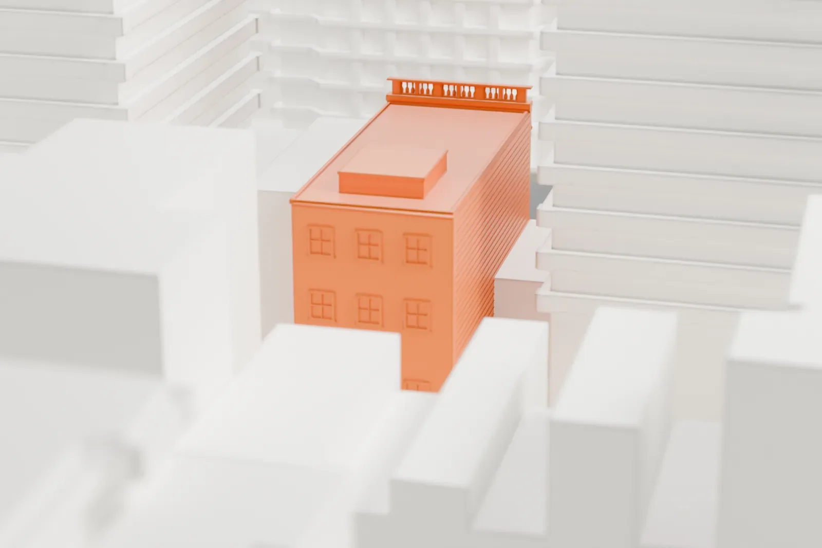 A white 3D print of the Yorkville Library, a compact three-story building wedged between much taller buildings.