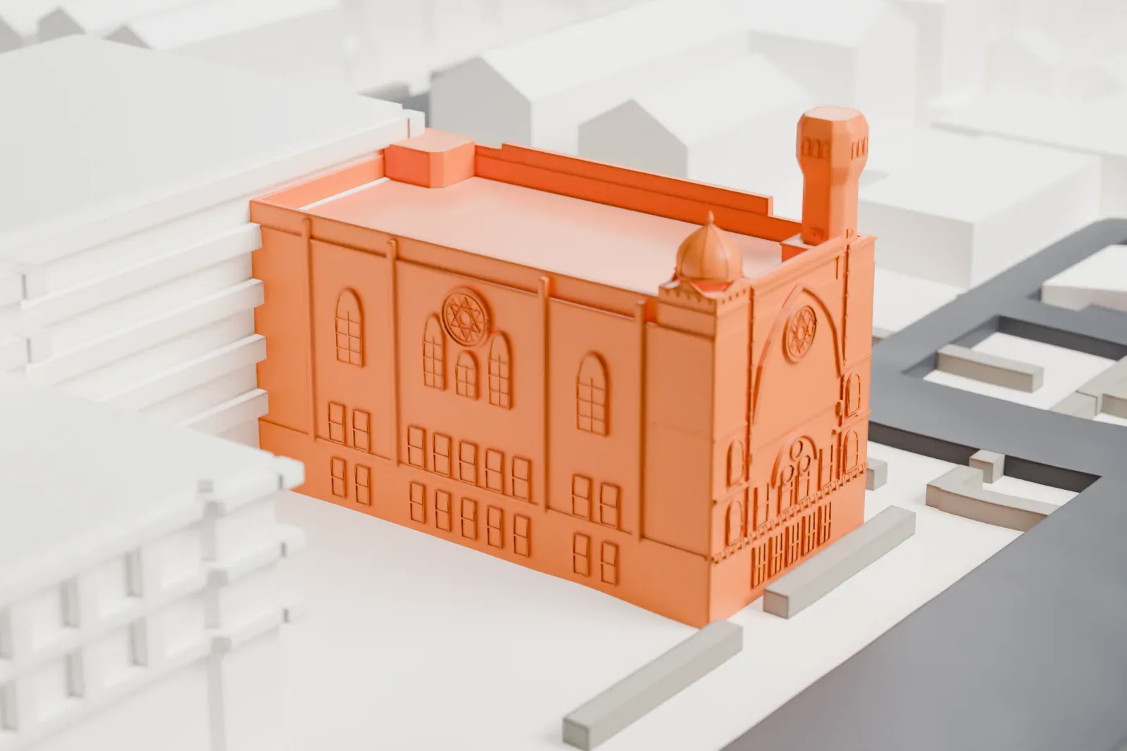 A white 3D print of Young Israel of Flatbush, a three-story building with small domed turrets at its corners, on a block of low buildings and streets.