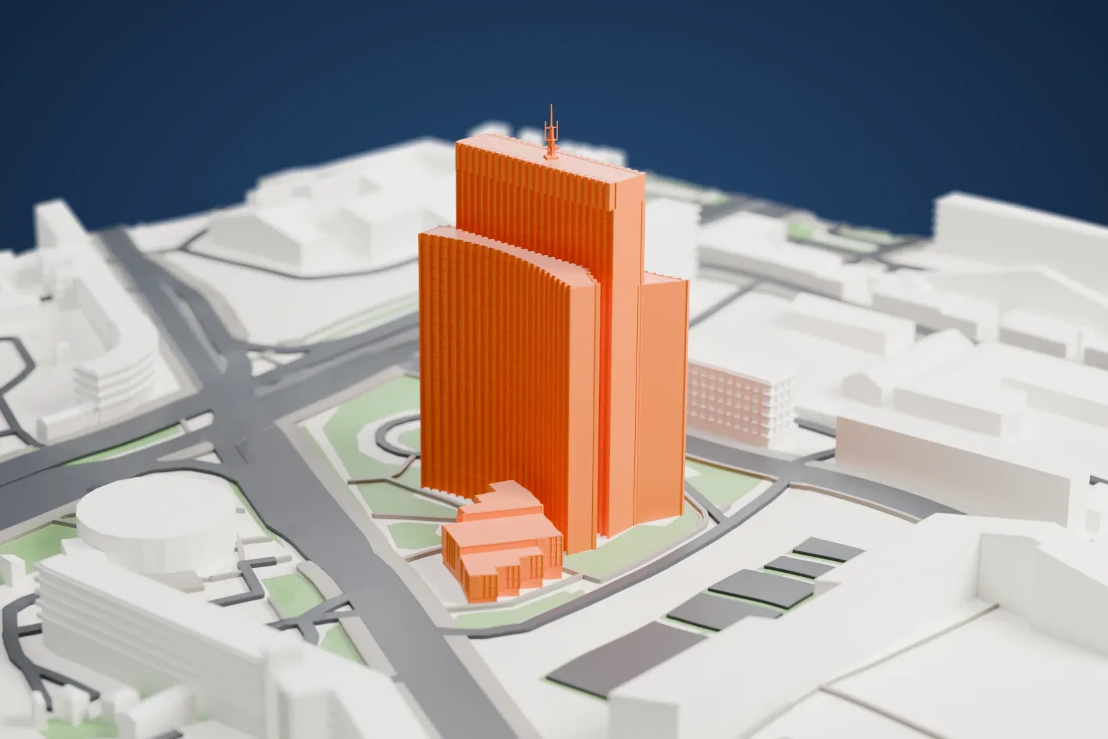 A white 3D print of Zagrepčanka, a tall three-part tower with curved side wings and a rooftop mast, beside a low building and the surrounding streets.