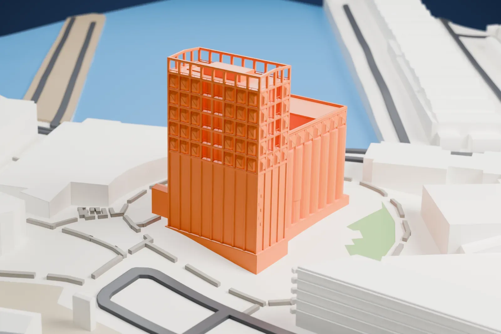 A white 3D print of the Zeitz Museum of Contemporary Art Africa, a converted grain silo of upright cylinders with a gridded tower beside it, next to the water and low waterfront buildings.