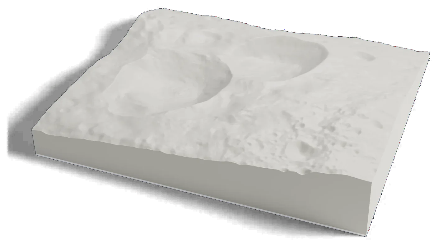 3D printed relief map of the Snowman craters on Vesta, three craters in a row on steeply sloping ground.