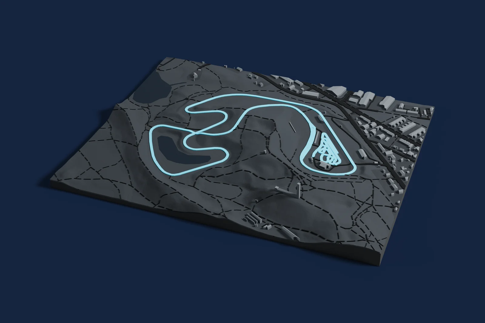 Render of a 3D printed map of Ahvenisto Race Circuit, the track in cyan on a dark grey model of the land and buildings around it.