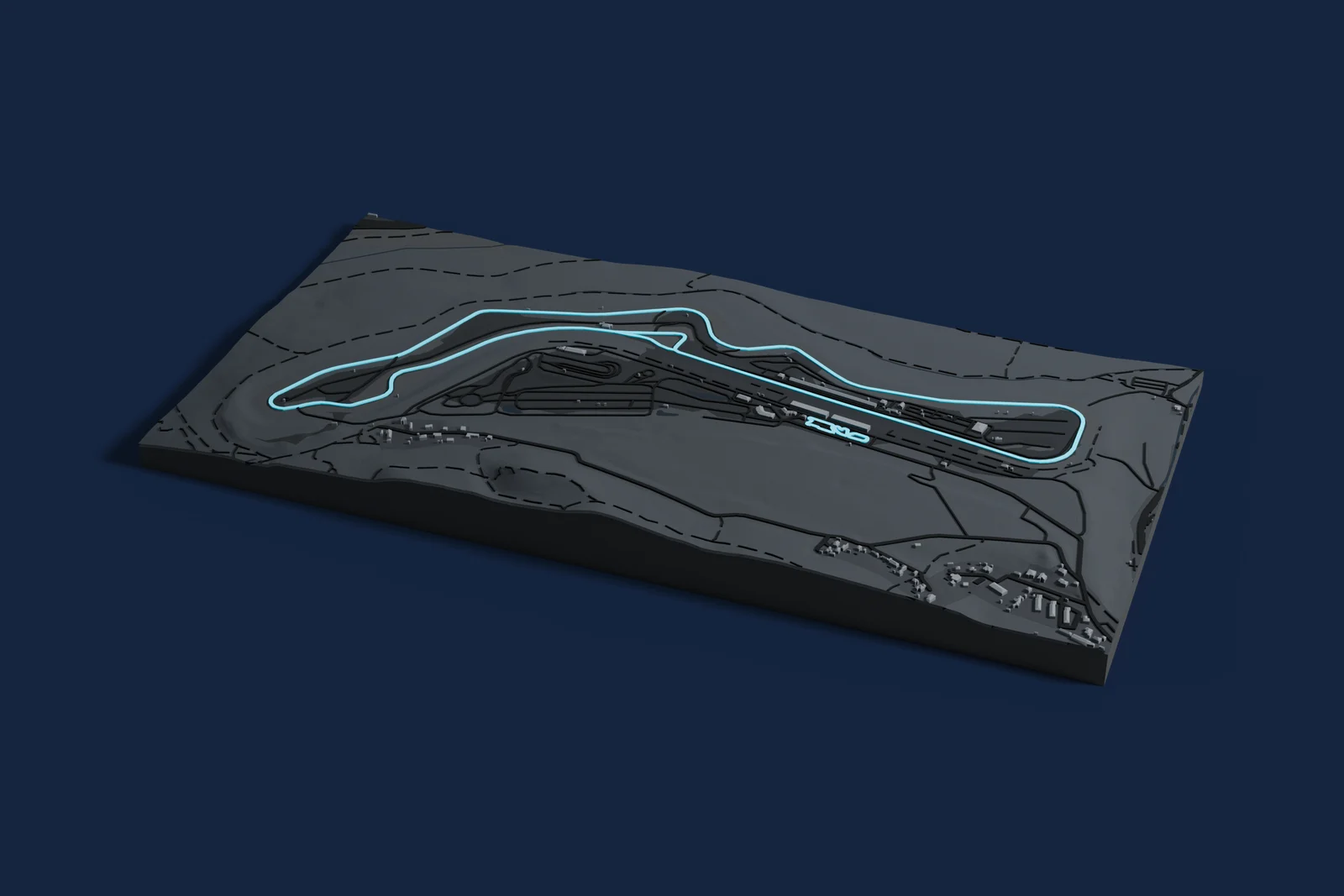 Render of a 3D printed map of Autodrom Most, the track in cyan on a dark grey model of the land and buildings around it.