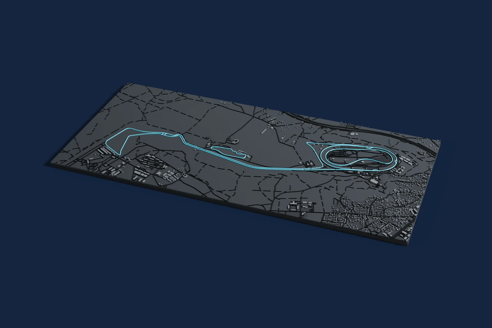 Render of a 3D printed map of Autodrome de Linas-Montlhéry, the track in cyan on a dark grey model of the land and buildings around it.