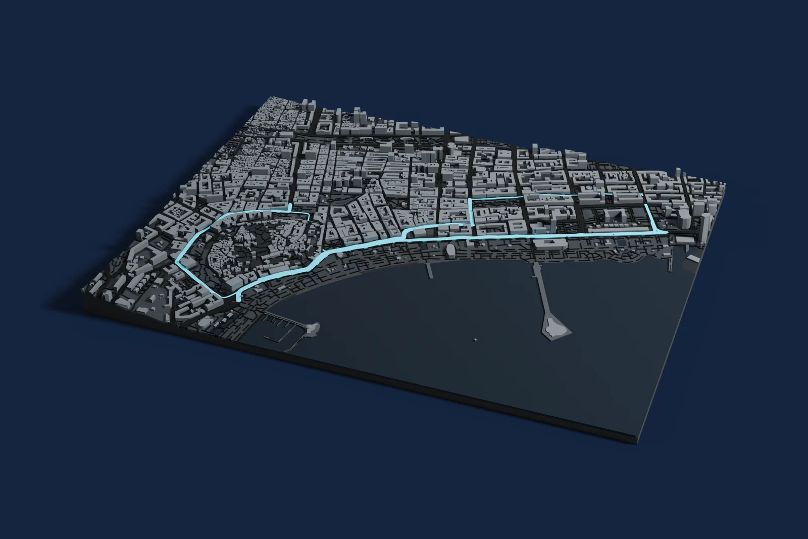 Render of a 3D printed map of Baku City Circuit, the track in cyan on a dark grey model of the land and buildings around it.
