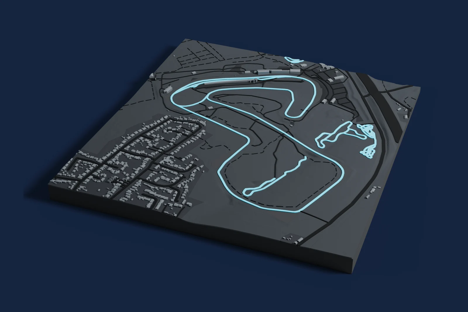 Render of a 3D printed map of Brands Hatch, the track in cyan on a dark grey model of the land and buildings around it.