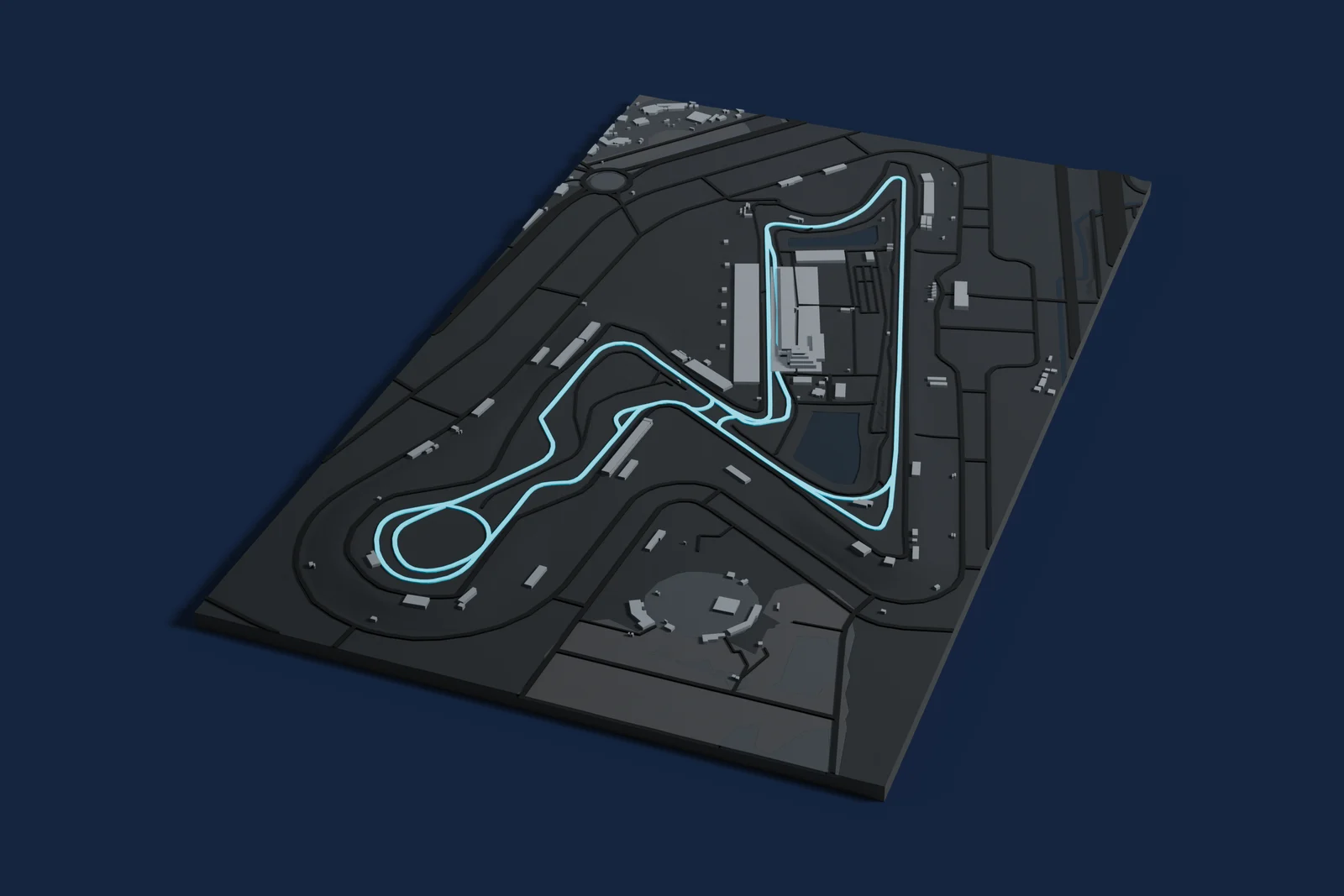 Render of a 3D printed map of Buddh International Circuit, the track in cyan on a dark grey model of the land and buildings around it.