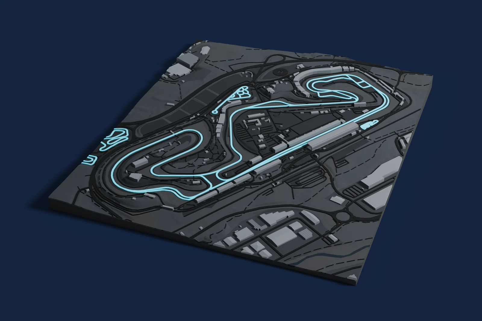 Render of a 3D printed map of Circuit de Barcelona-Catalunya, the track in cyan on a dark grey model of the land and buildings around it.
