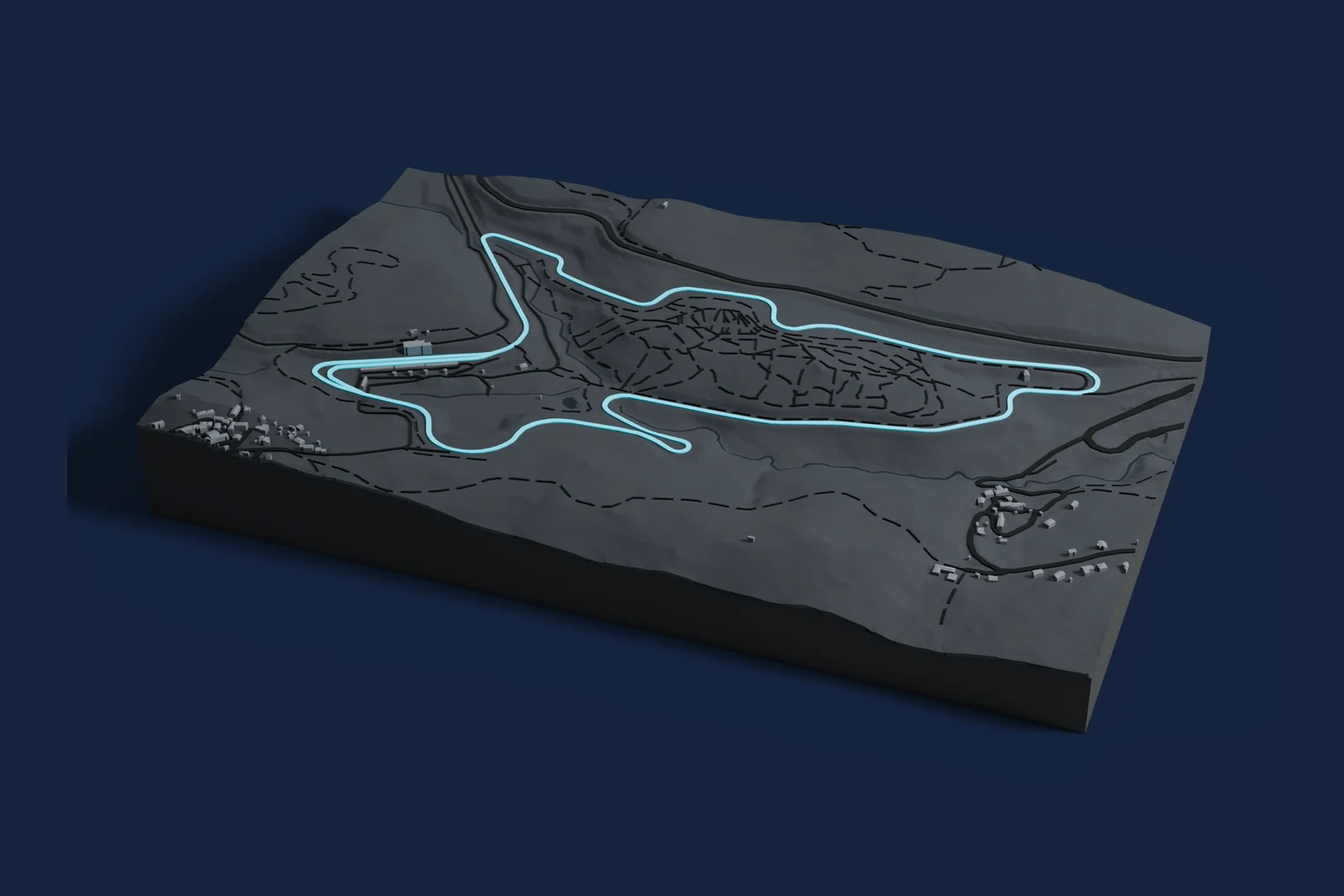 Render of a 3D printed map of Circuit de Charade, the track in cyan on a dark grey model of the land and buildings around it.