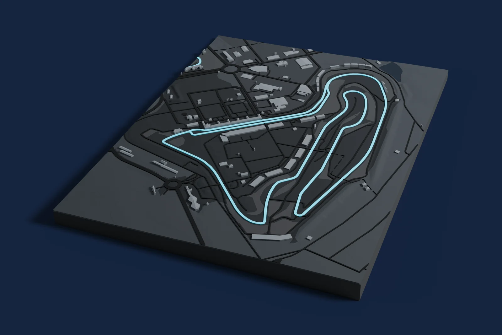 Render of a 3D printed map of Circuit de Nevers Magny-Cours, the track in cyan on a dark grey model of the land and buildings around it.
