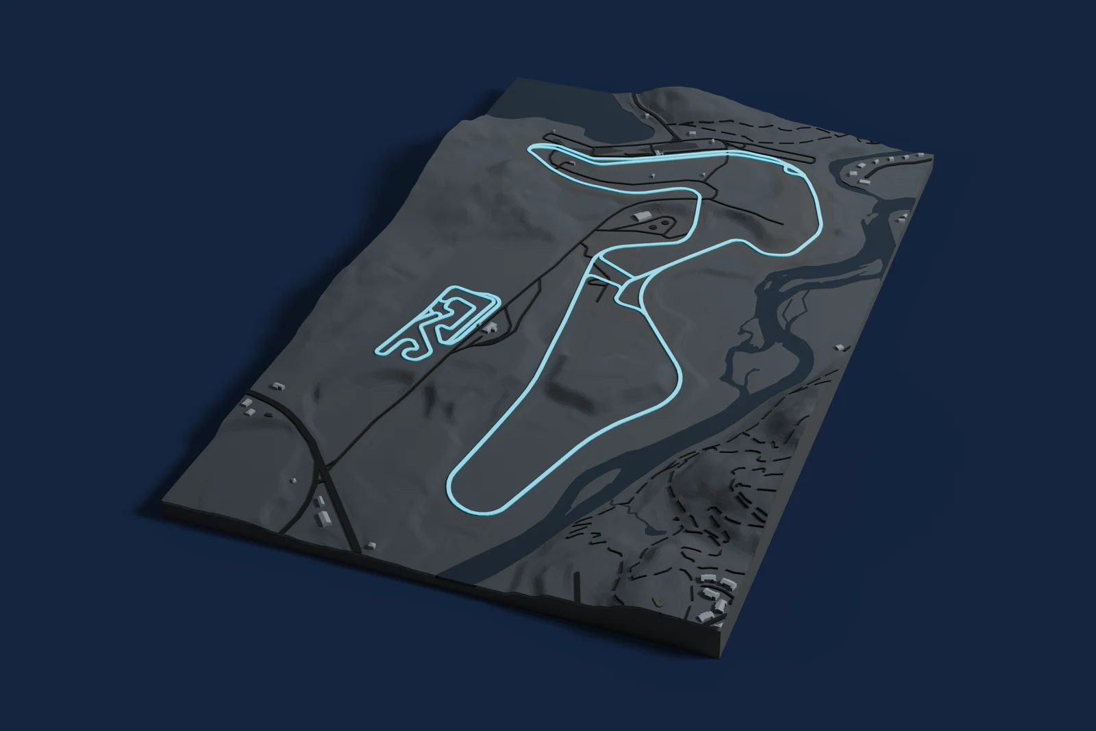 Render of a 3D printed map of Circuit Mont-Tremblant, the track in cyan on a dark grey model of the land and buildings around it.
