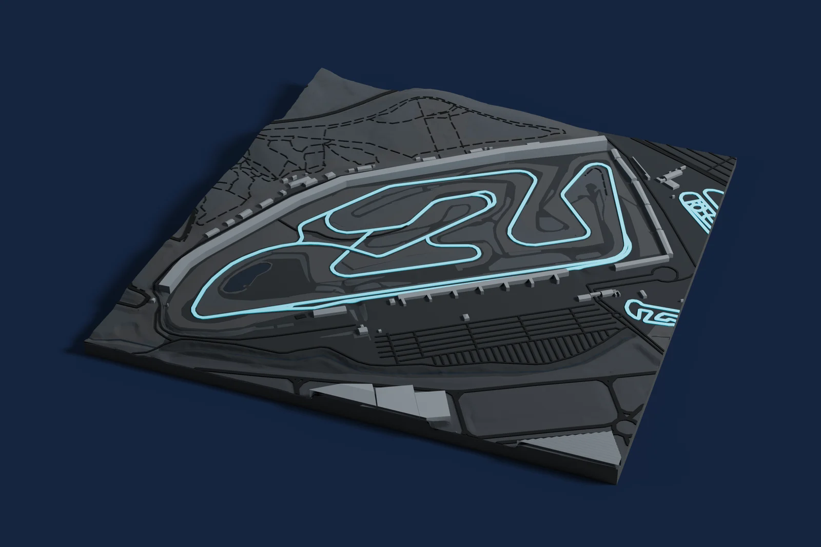 Render of a 3D printed map of Circuit Ricardo Tormo, the track in cyan on a dark grey model of the land and buildings around it.