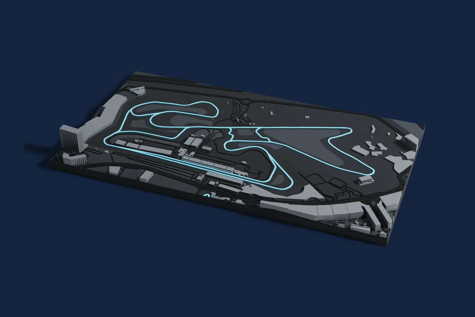Render of a 3D printed map of Dubai Autodrome, the track in cyan on a dark grey model of the land and buildings around it.