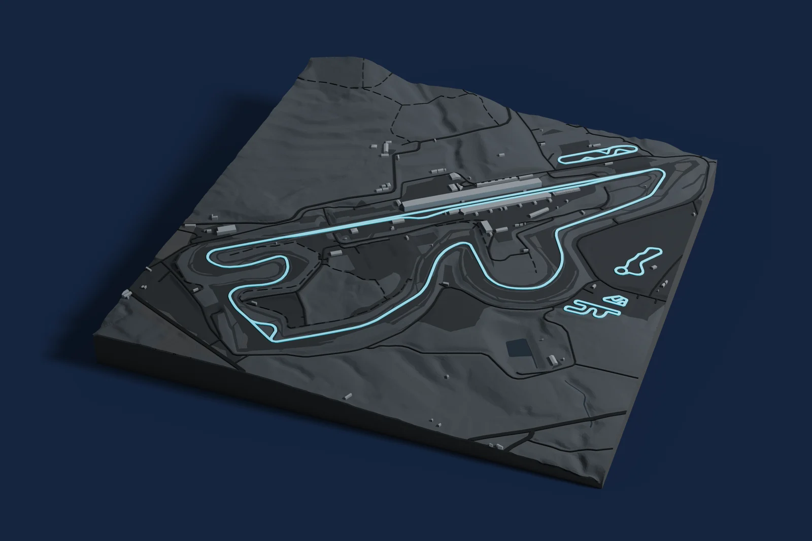 Render of a 3D printed map of Fuji Speedway, the track in cyan on a dark grey model of the land and buildings around it.