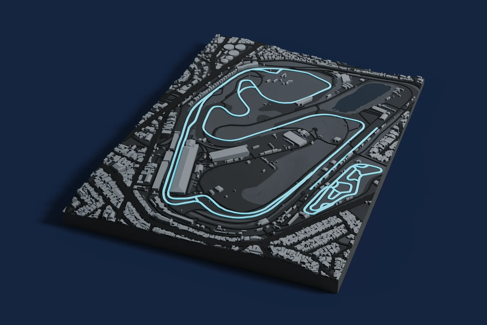 Render of a 3D printed map of Interlagos Circuit, the track in cyan on a dark grey model of the land and buildings around it.