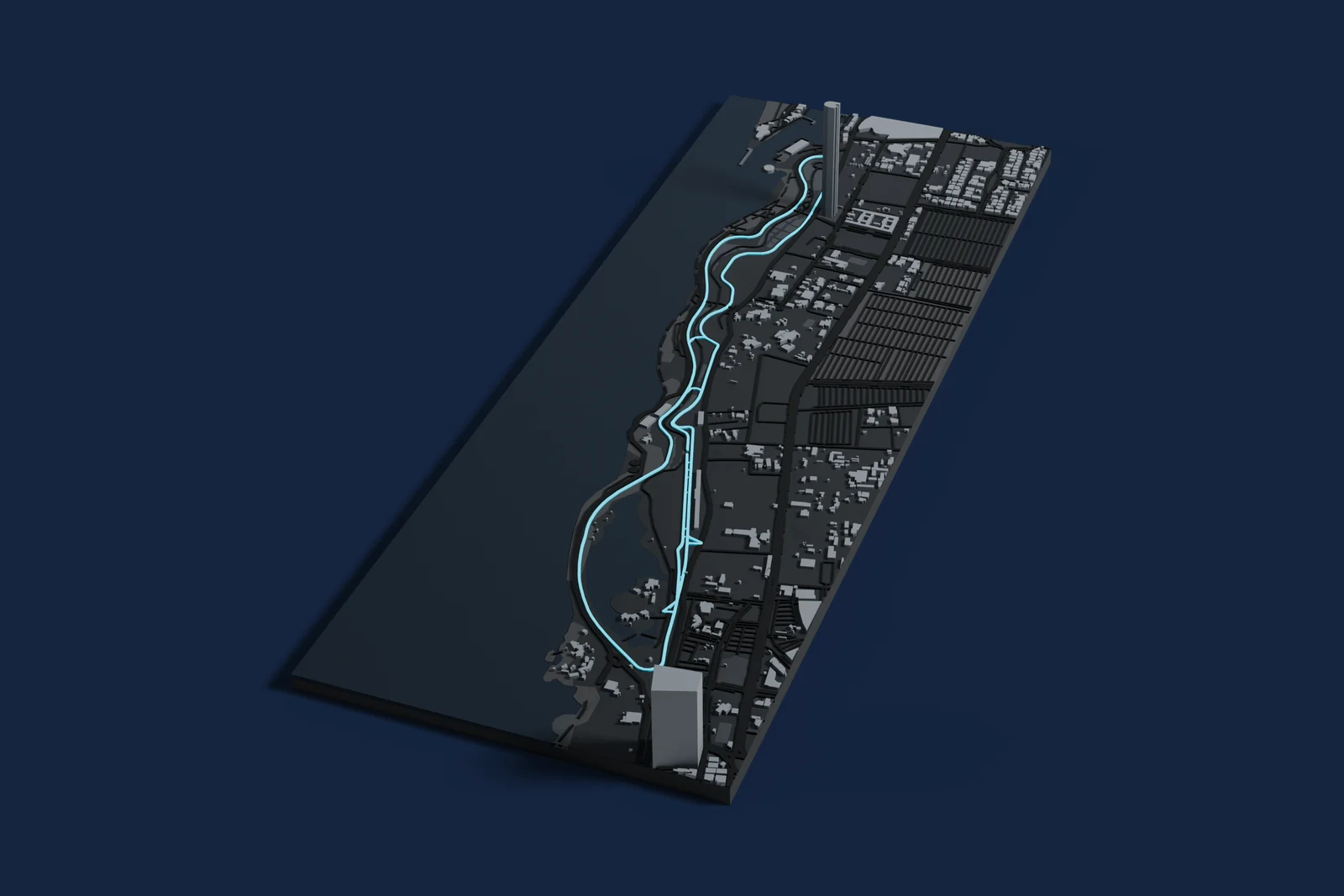 Render of a 3D printed map of Jeddah Corniche Circuit, the track in cyan on a dark grey model of the land and buildings around it.
