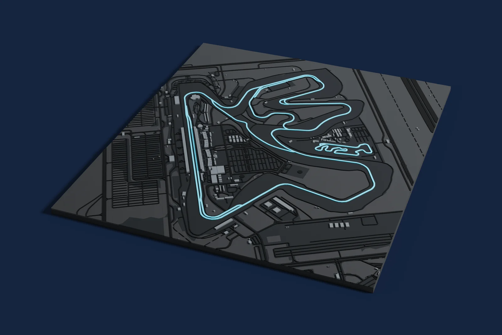 Render of a 3D printed map of Lusail International Circuit, the track in cyan on a dark grey model of the land and buildings around it.