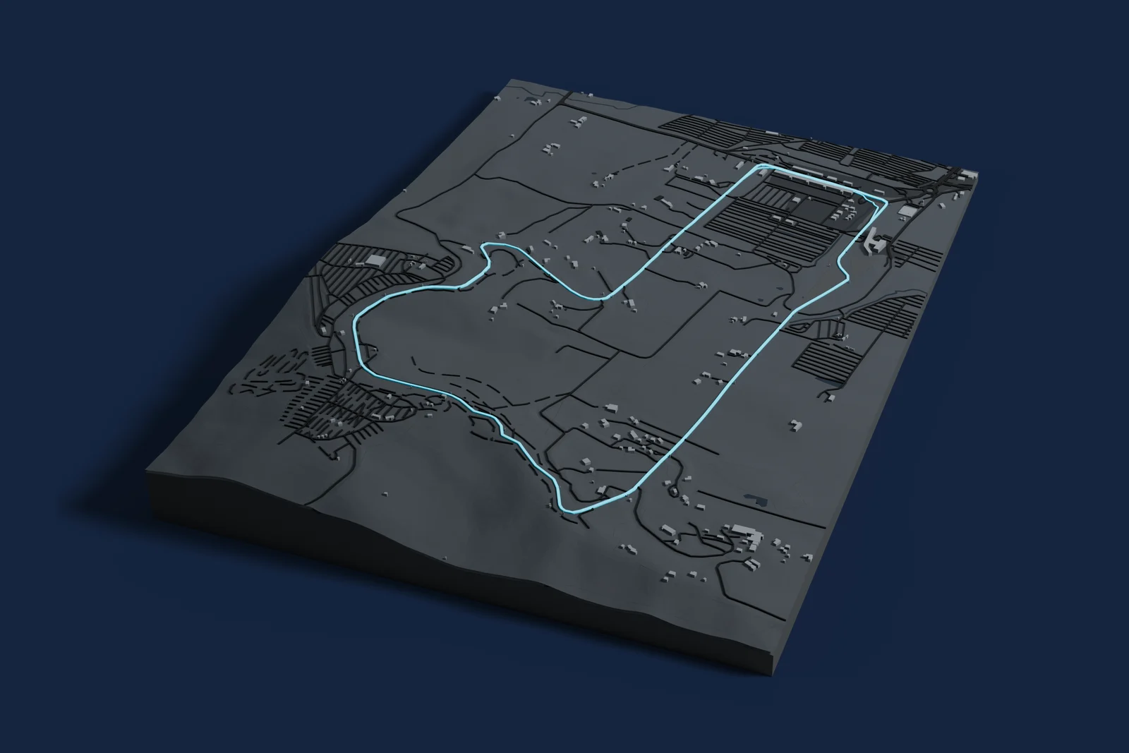 Render of a 3D printed map of Mount Panorama Circuit, the track in cyan on a dark grey model of the land and buildings around it.