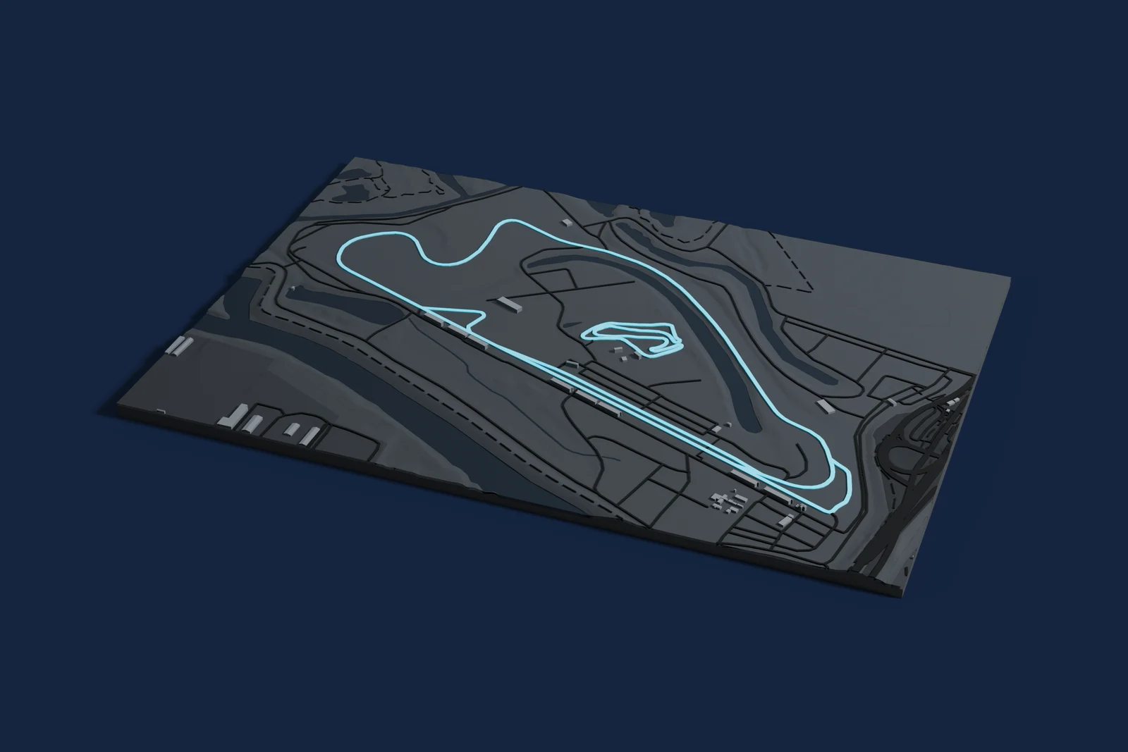 Render of a 3D printed map of Portland International Raceway, the track in cyan on a dark grey model of the land and buildings around it.