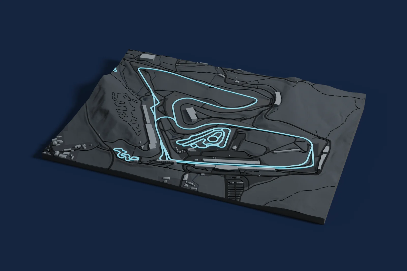Render of a 3D printed map of Red Bull Ring, the track in cyan on a dark grey model of the land and buildings around it.