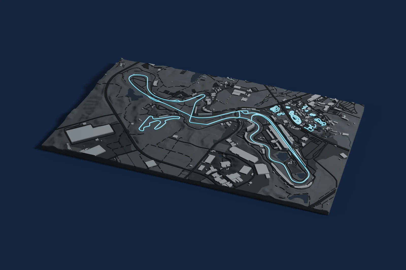 Render of a 3D printed map of Suzuka Circuit, the track in cyan on a dark grey model of the land and buildings around it.