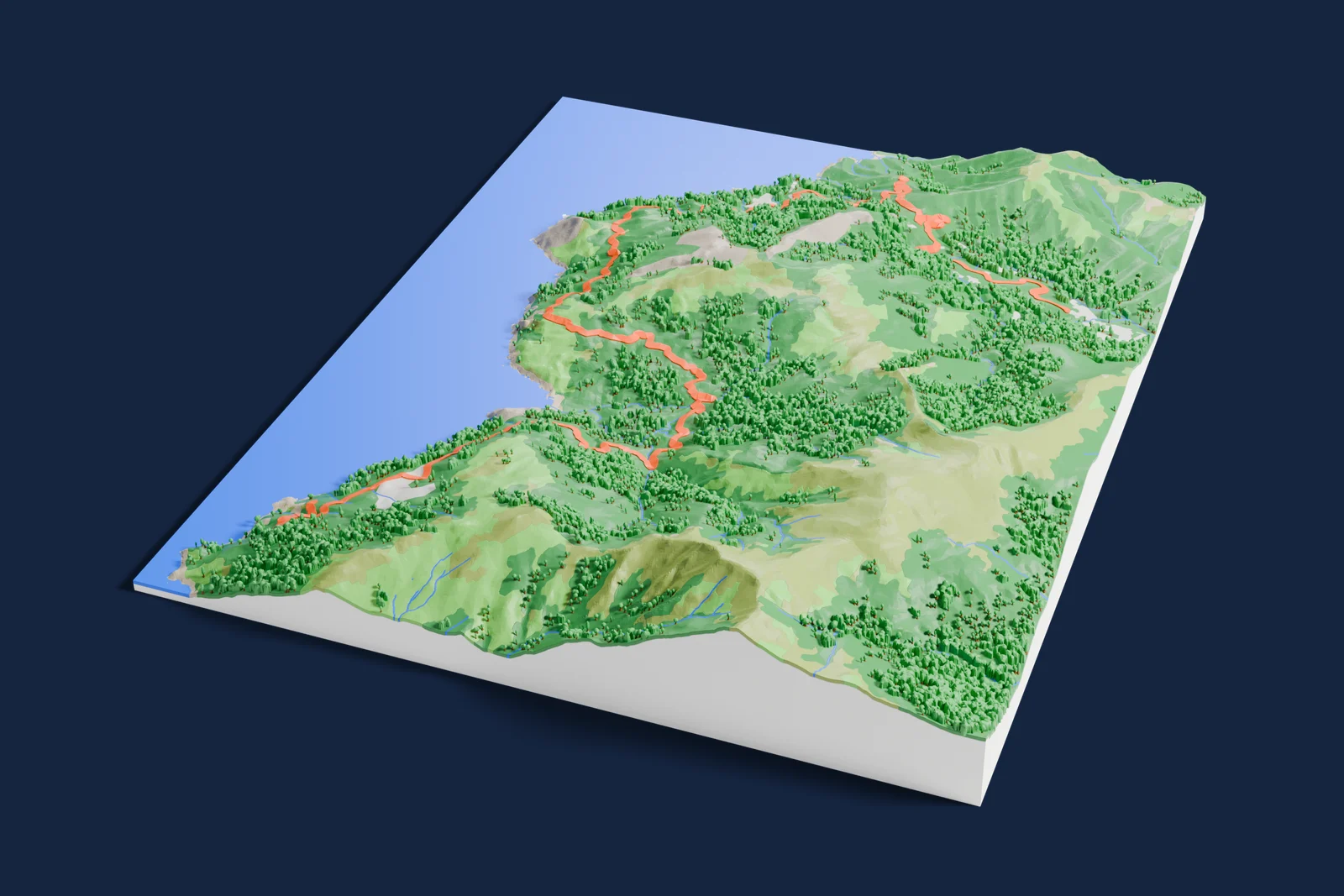 Render of a 3D printed terrain map of the Cap Corse rally stage, the road in orange winding across the terrain.